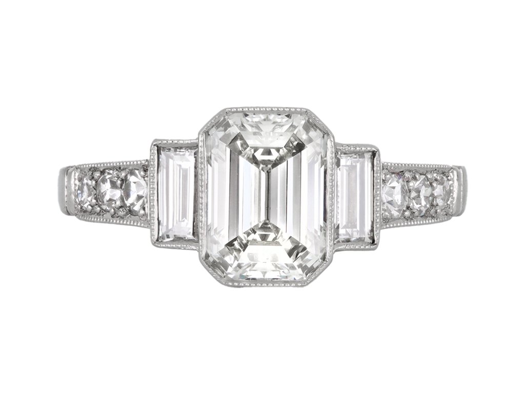 Emerald cut diamond flanked solitaire ring, circa 1925. hatton garden