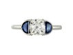 Diamond and sapphire flanked solitaire ring, English, circa 1920.