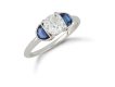 Diamond and sapphire flanked solitaire ring, English, circa 1920.