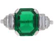 Art Deco Colombian emerald and diamond flanked solitaire ring, circa 1925.