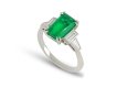 Colombian emerald and diamond flanked solitaire ring, circa 1950