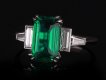 Colombian emerald and diamond flanked solitaire ring, circa 1950