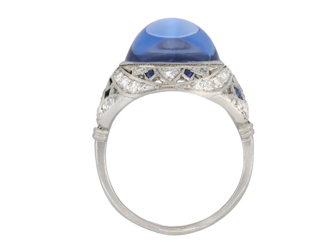 Cabochon Ceylon sapphire and diamond cluster ring, circa 1920.