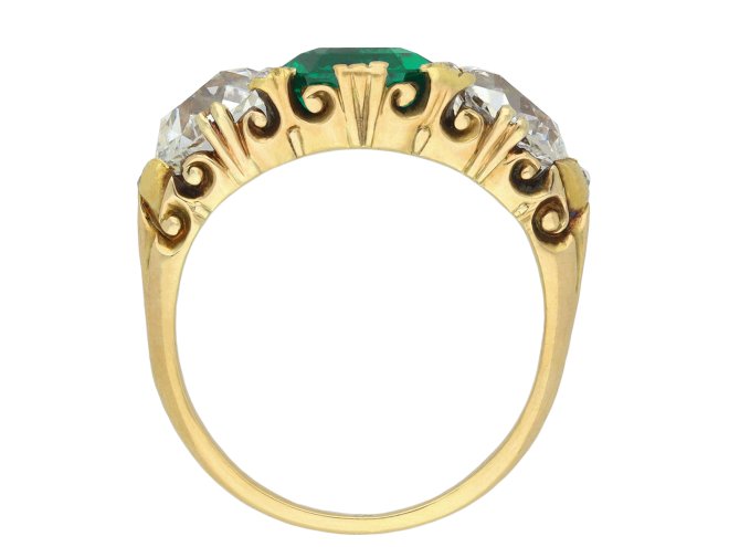 Antique emerald and diamond carved three stone ring hatton garden