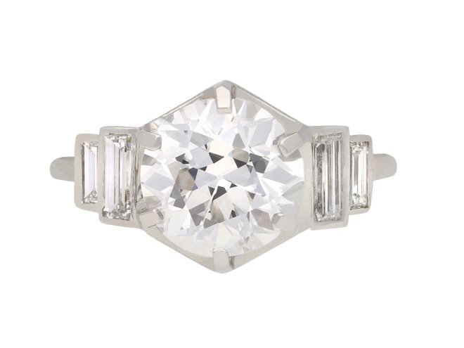 Solitaire diamond engagement ring with diamond set shoulders, French, circa 1930. Hatton Garden