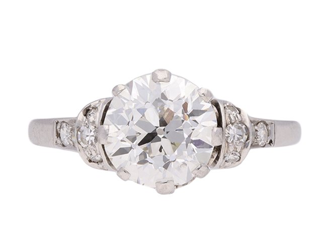 Old cut diamond flanked solitaire ring, circa 1920.  Hatton Garden