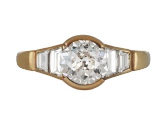 Vintage diamond flanked solitaire ring, circa 1970.