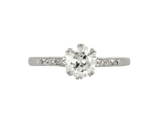 Old cut diamond flanked solitaire ring, circa 1920.