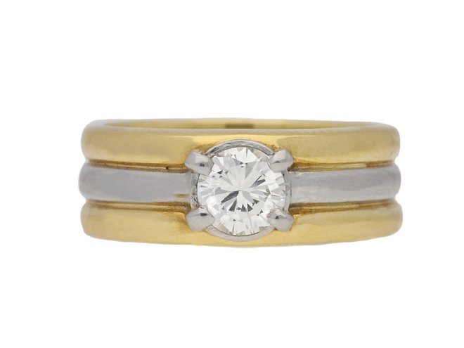 Contemporary solitaire diamond ring in 18ct yellow gold.