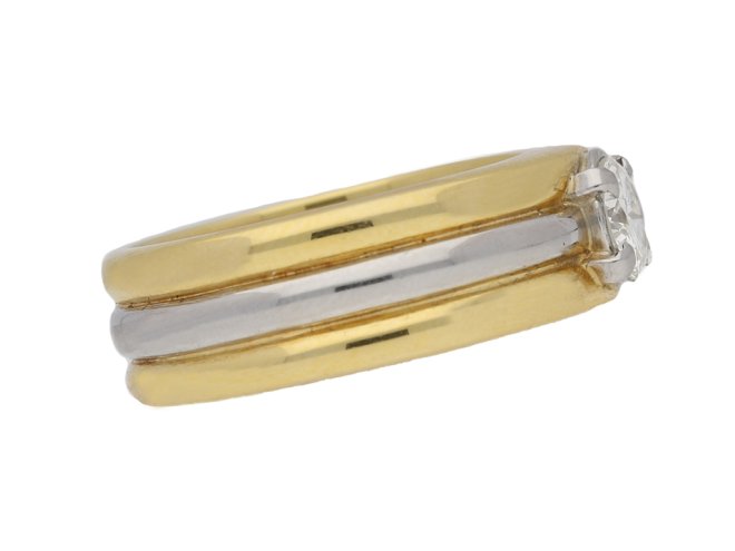 Contemporary solitaire diamond ring in 18ct yellow gold.