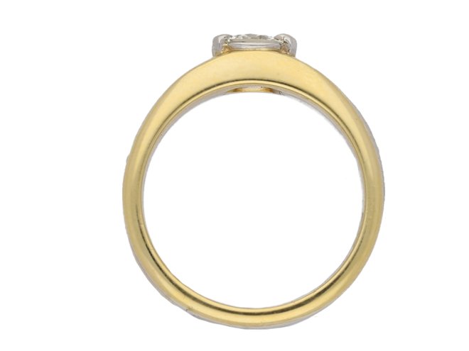 Contemporary solitaire diamond ring in 18ct yellow gold.